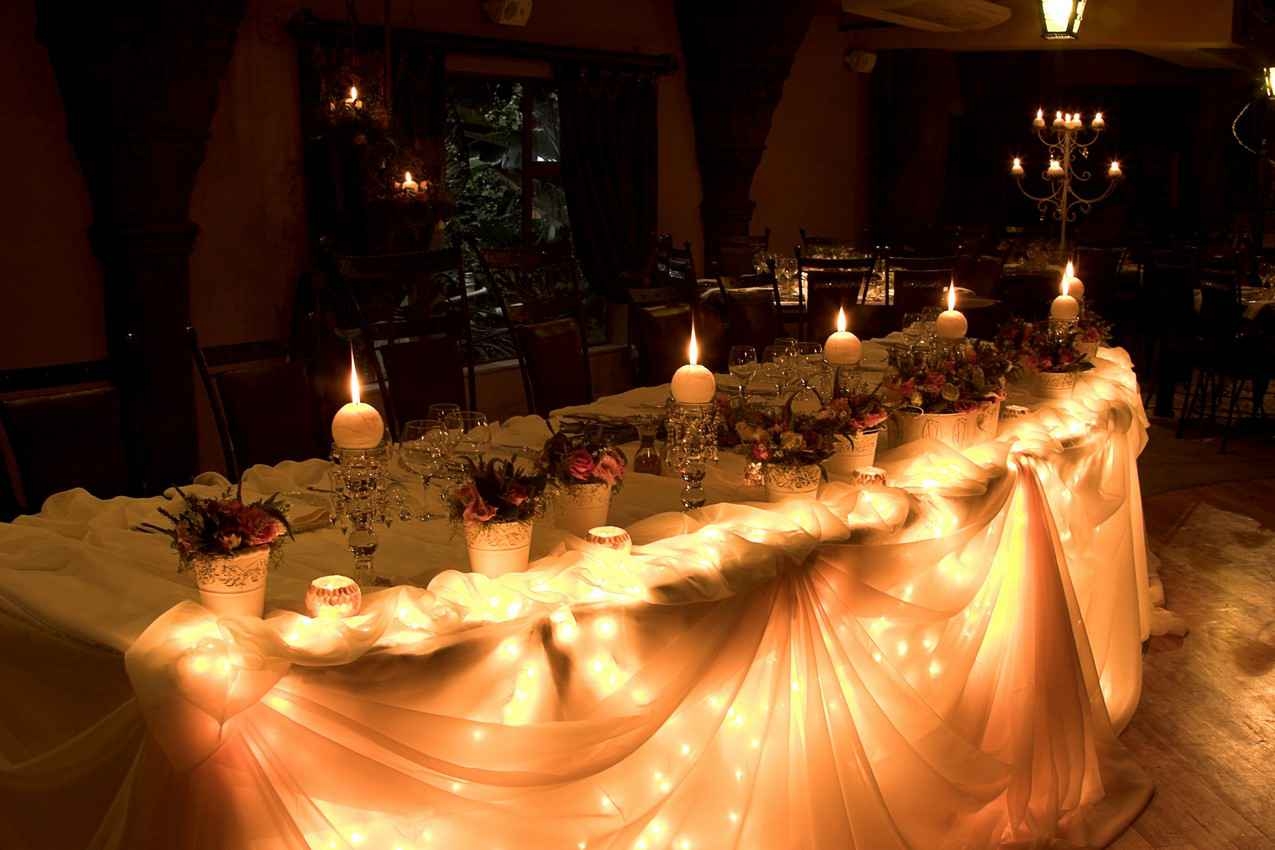 A brightly lit wedding party table at a Playa Del Carmen resort.