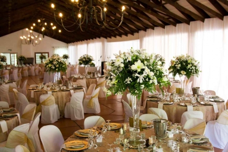 A wedding facility with fancy tables and decorations.