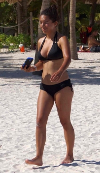 A hot Mexican babe who was walking along the beach in Akumal.