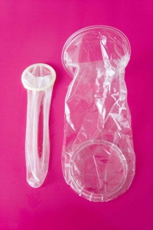 A male condom and a female condom side-by-side.