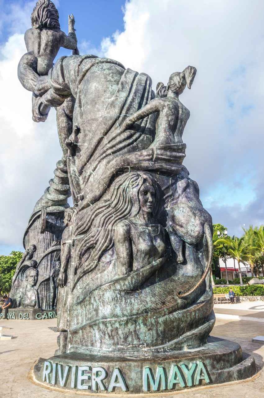 The amazing Riviera Maya statue featuring a hot woman and located on the edge of the Playa Del Carmen beach.