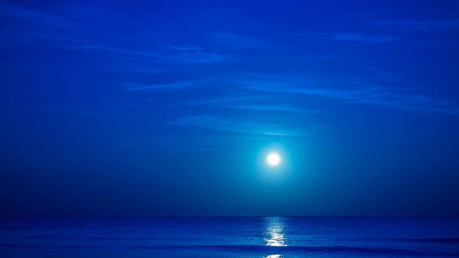 The beautiful moonlight reflecting off of the ocean near the Playa Del Carmen beach.