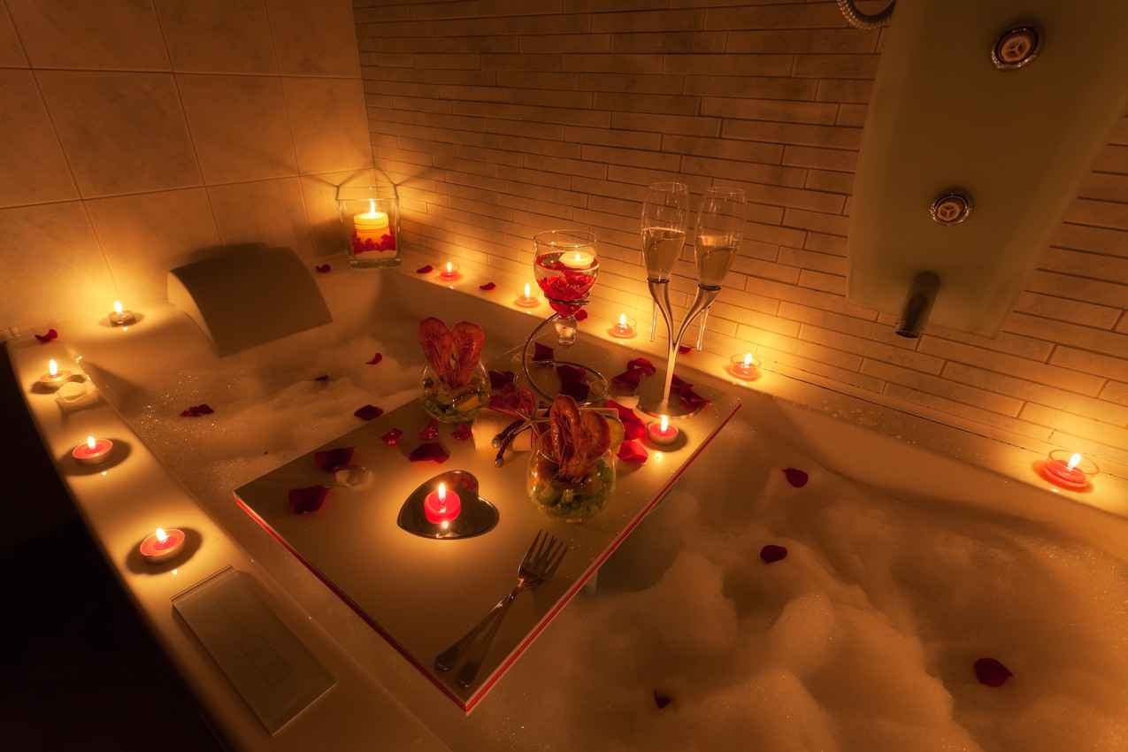A candlelit romantic Jacuzzi with champagne served at a Playa Del Carmen wedding resort.