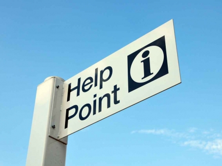 Sign post that says Tourist Help Point.