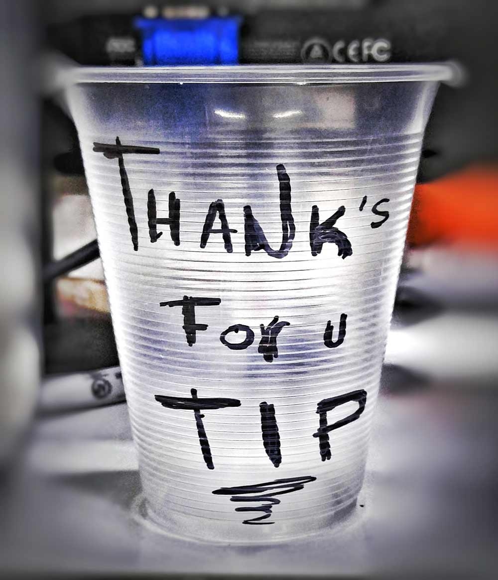 A tip cup that was on the counter of a liquor store in Playa Del Carmen.