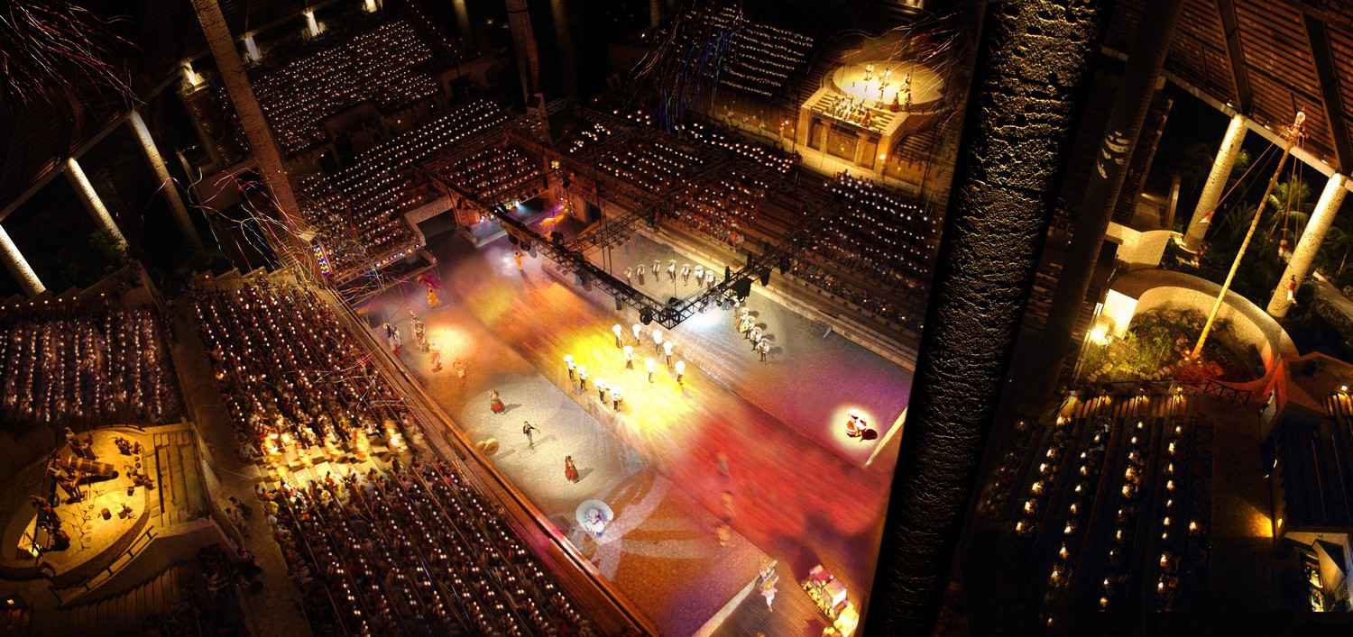 A traditional dance and ritual performance in the Xcaret Stadium.
