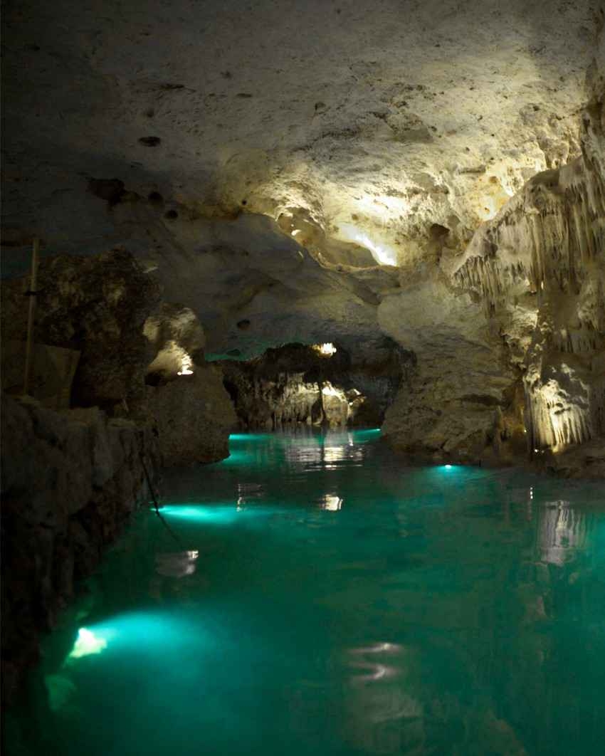 A view from the inside of a well lit cave.